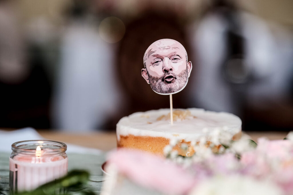 Wedding cake featuring face of the groom 