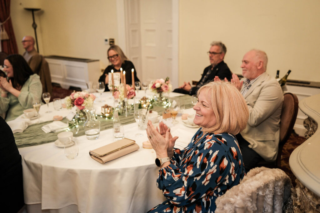 Fawsley Hall guests listening to wedding speeches