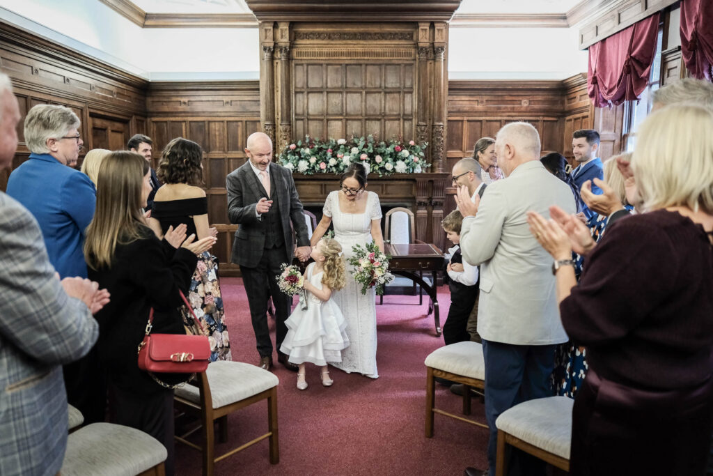 Fawsley Hall wedding groom points the way