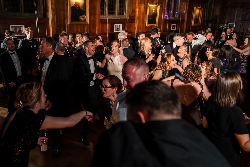 Partying in the Great Hall at Selwyn College, Cambridge wedding photography