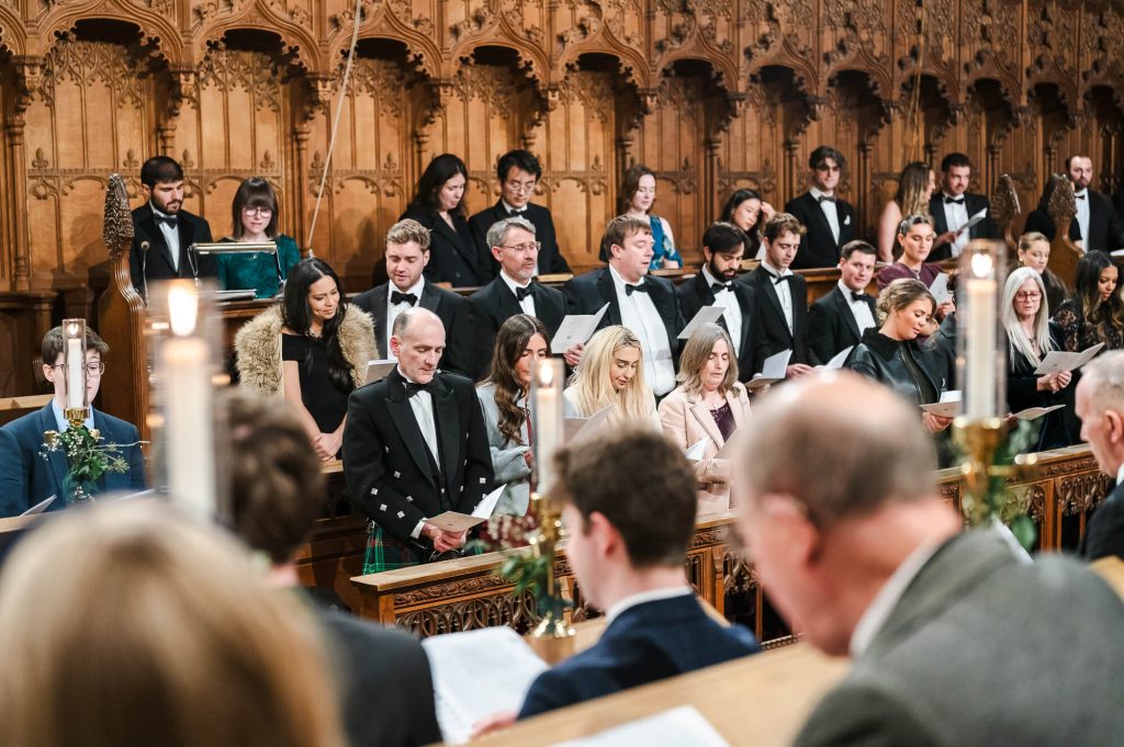 Choir singing at Selwyn College, Cambridge wedding photography