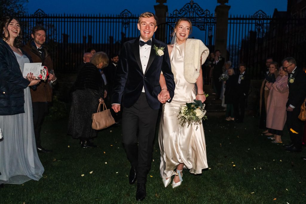 Happy bride and groom after sunset, Cambridge wedding photography
