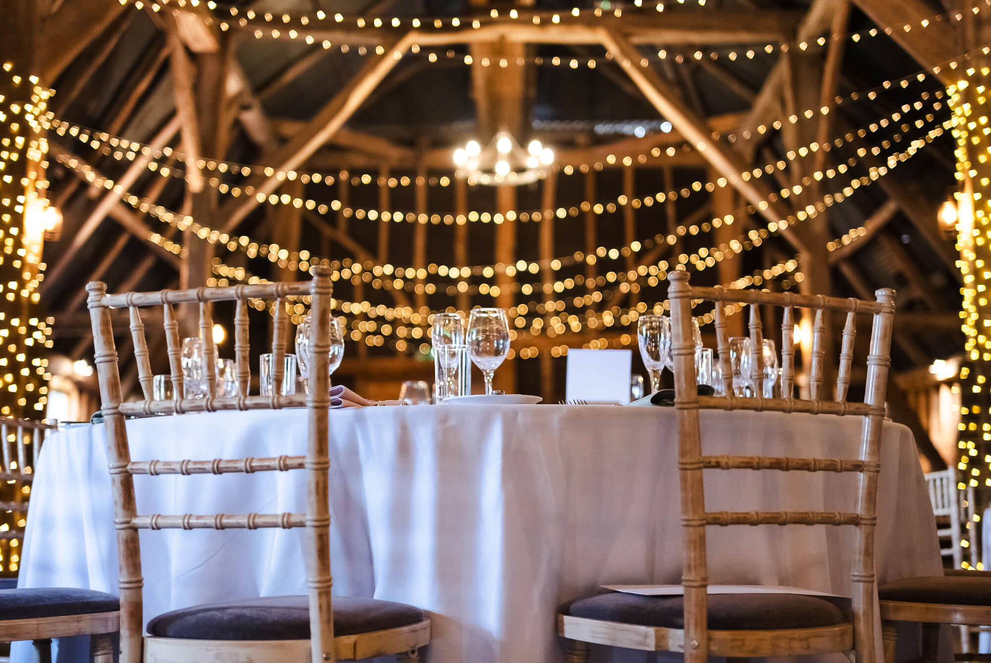 Dining table and fairy lights, Manor Barn Harlton wedding, Cambridge 
