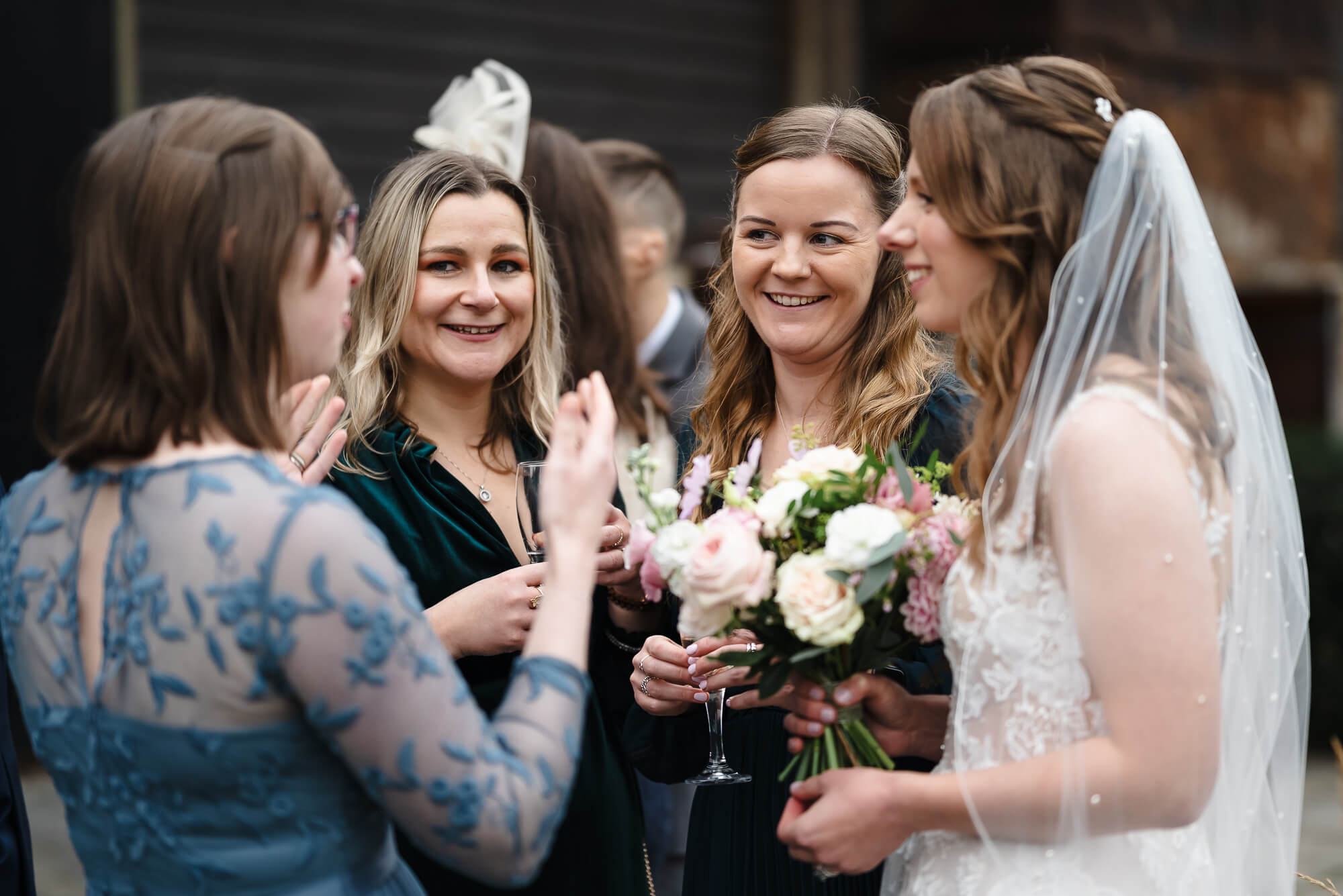 Manor Barn Harlton wedding guests laughing, Cambridge